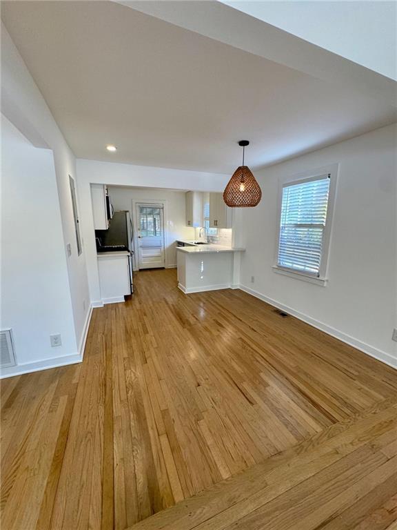 635 Valley Brook Road Decatur, GA 30033 - Photo 3 of 17 a bedroom with a bed and wooden floor