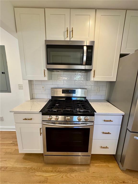635 Valley Brook Road Decatur, GA 30033 - Photo 4 of 17 a stove top oven sitting inside of a kitchen