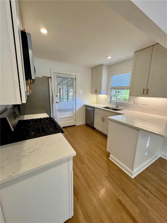 635 Valley Brook Road Decatur, GA 30033 - Photo 5 of 17 a kitchen with a stove a sink and a refrigerator