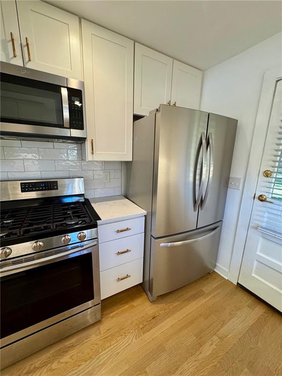 635 Valley Brook Road Decatur, GA 30033 - Photo 6 of 17 a kitchen with granite countertop a stainless steel appliances and wooden floor