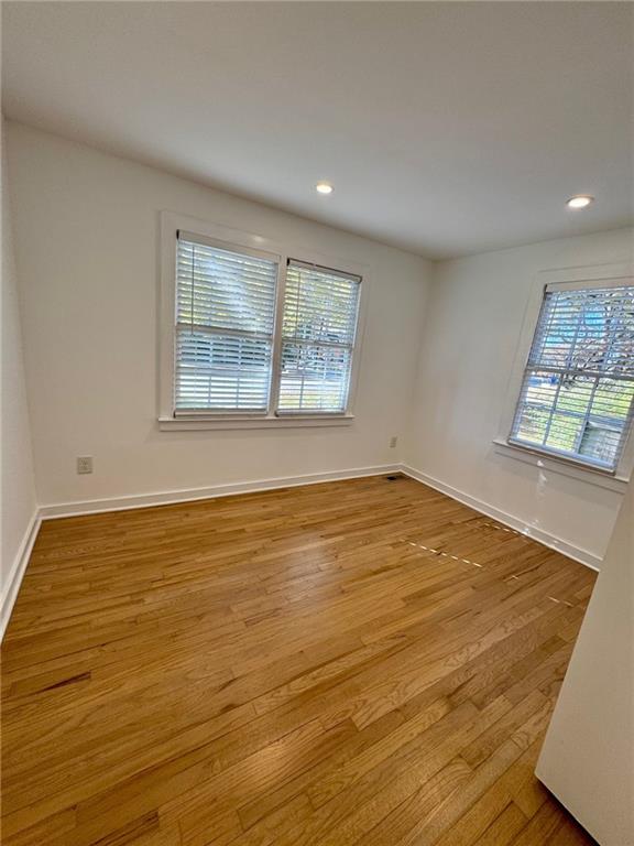 635 Valley Brook Road Decatur, GA 30033 - Photo 8 of 17 a view of an empty room with wooden floor and a window