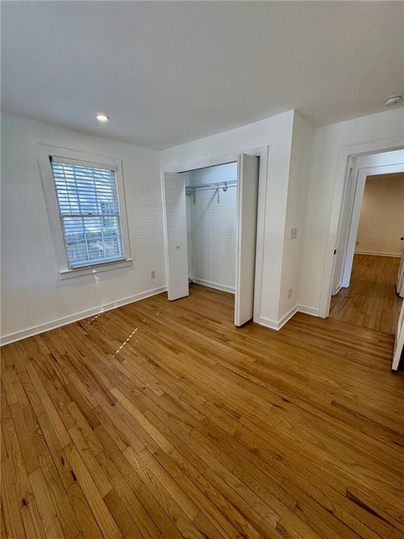 635 Valley Brook Road Decatur, GA 30033 - Photo 9 of 17 a view of empty room with wooden floor and fan
