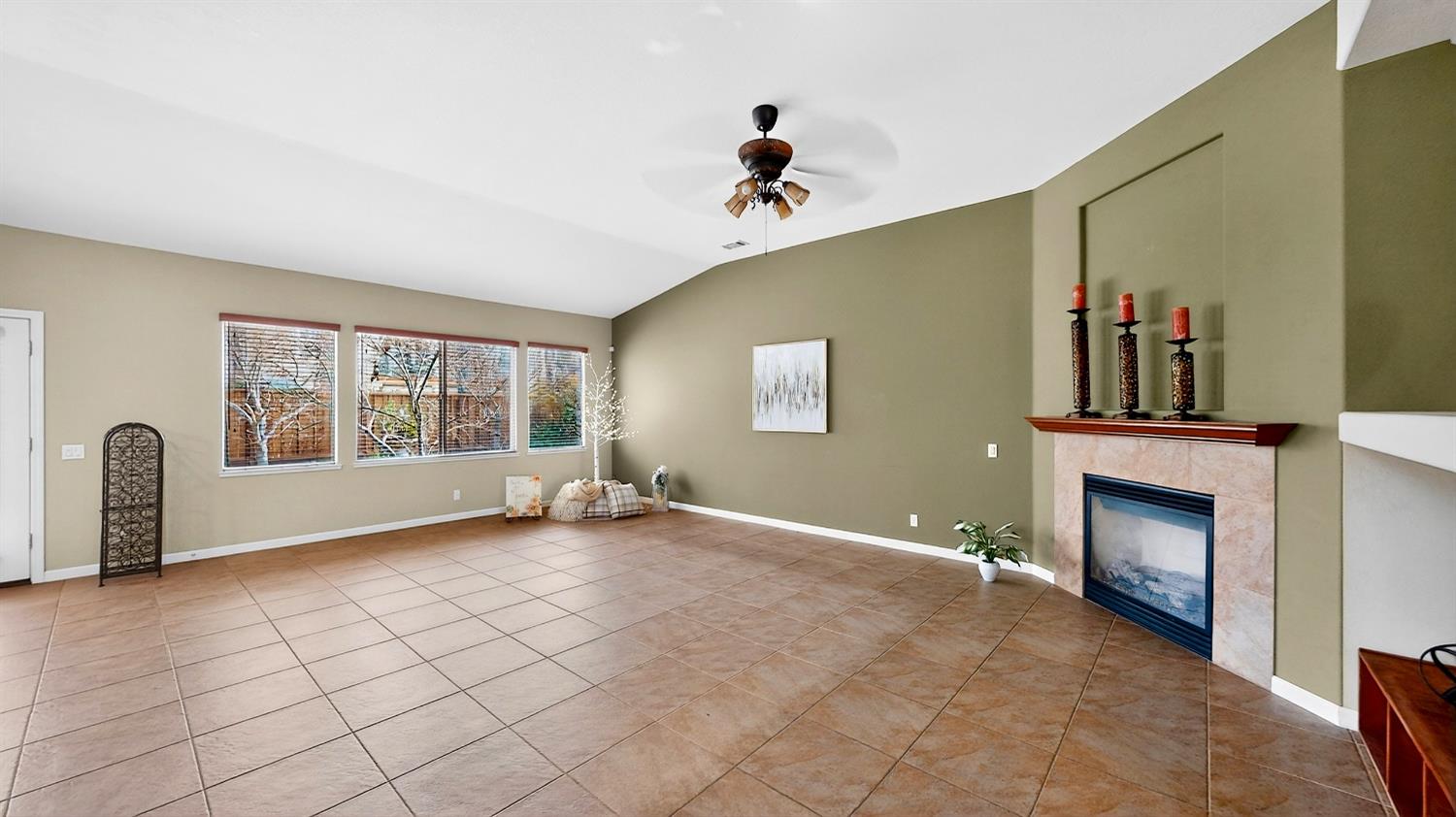 4102 Windrose Drive Turlock, CA 95382 - Photo 15 of 45 a view of a livingroom with a fireplace and window