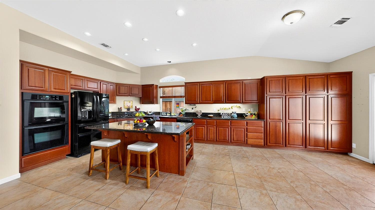 4102 Windrose Drive Turlock, CA 95382 - Photo 16 of 45 a kitchen with stainless steel appliances granite countertop a refrigerator and a stove top oven