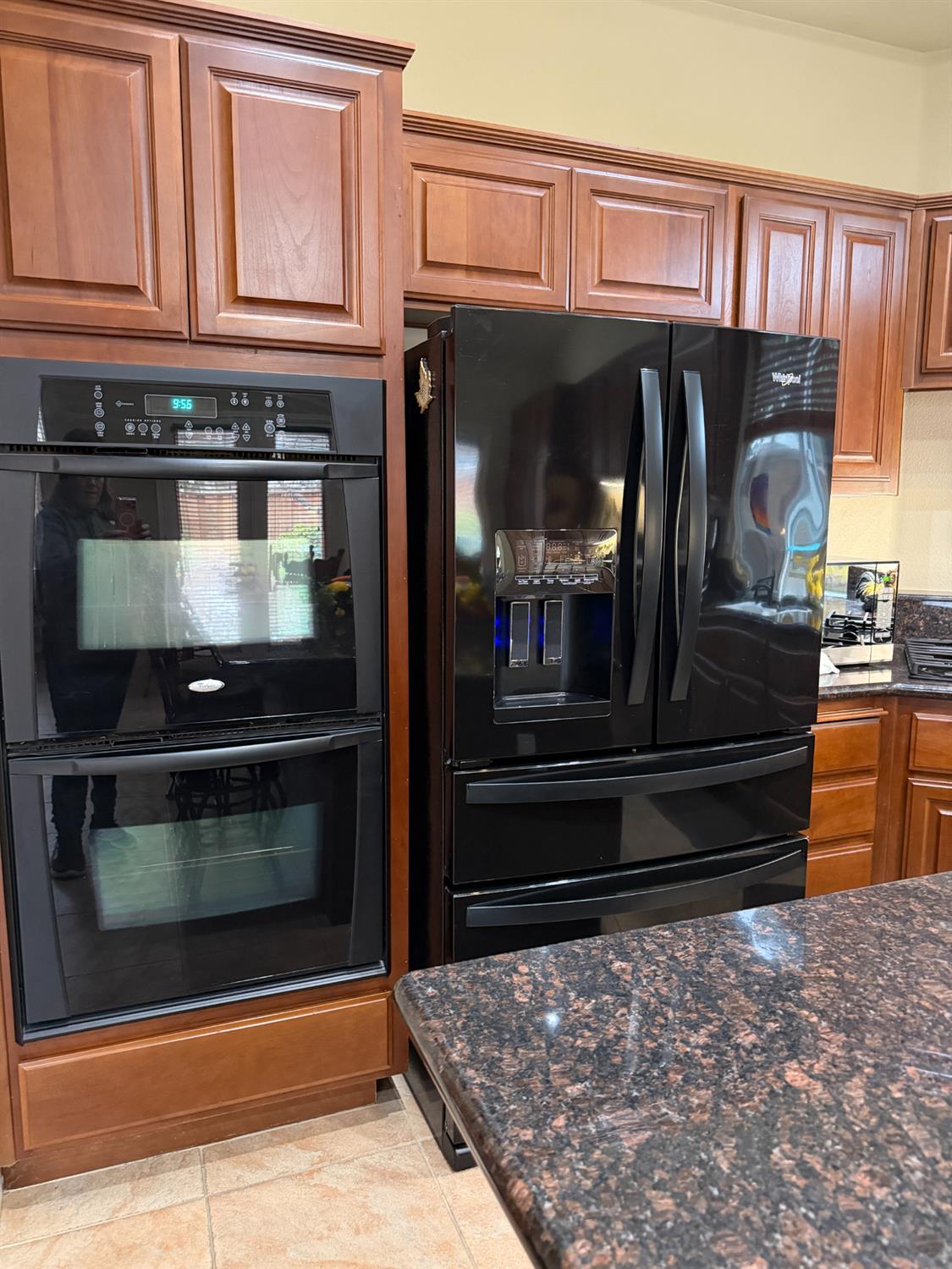 4102 Windrose Drive Turlock, CA 95382 - Photo 18 of 45 a kitchen with granite countertop a stove and cabinets