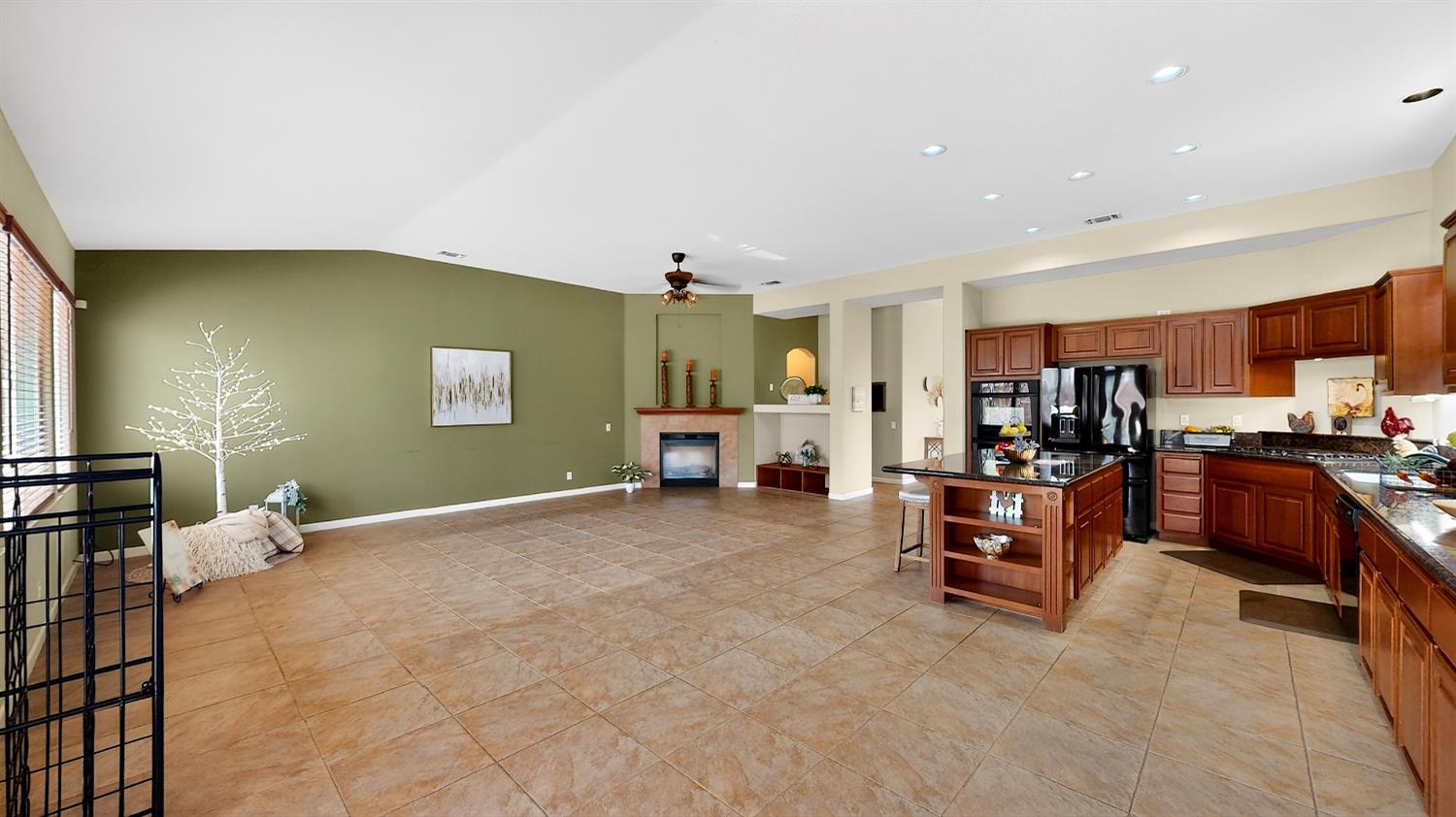 4102 Windrose Drive Turlock, CA 95382 - Photo 20 of 45 a view of living room with furniture and a kitchen