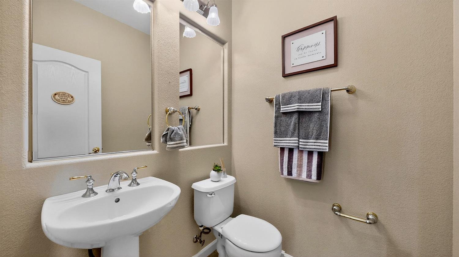 4102 Windrose Drive Turlock, CA 95382 - Photo 21 of 45 a bathroom with a sink a toilet and mirror