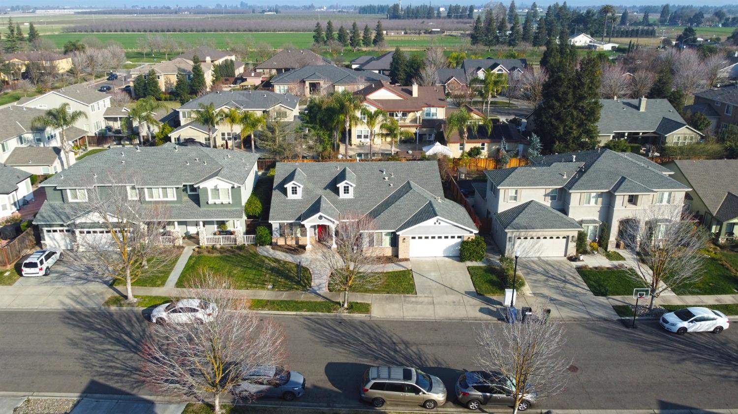 4102 Windrose Drive Turlock, CA 95382 - Photo 4 of 45 an aerial view of a house with a garden and lake view
