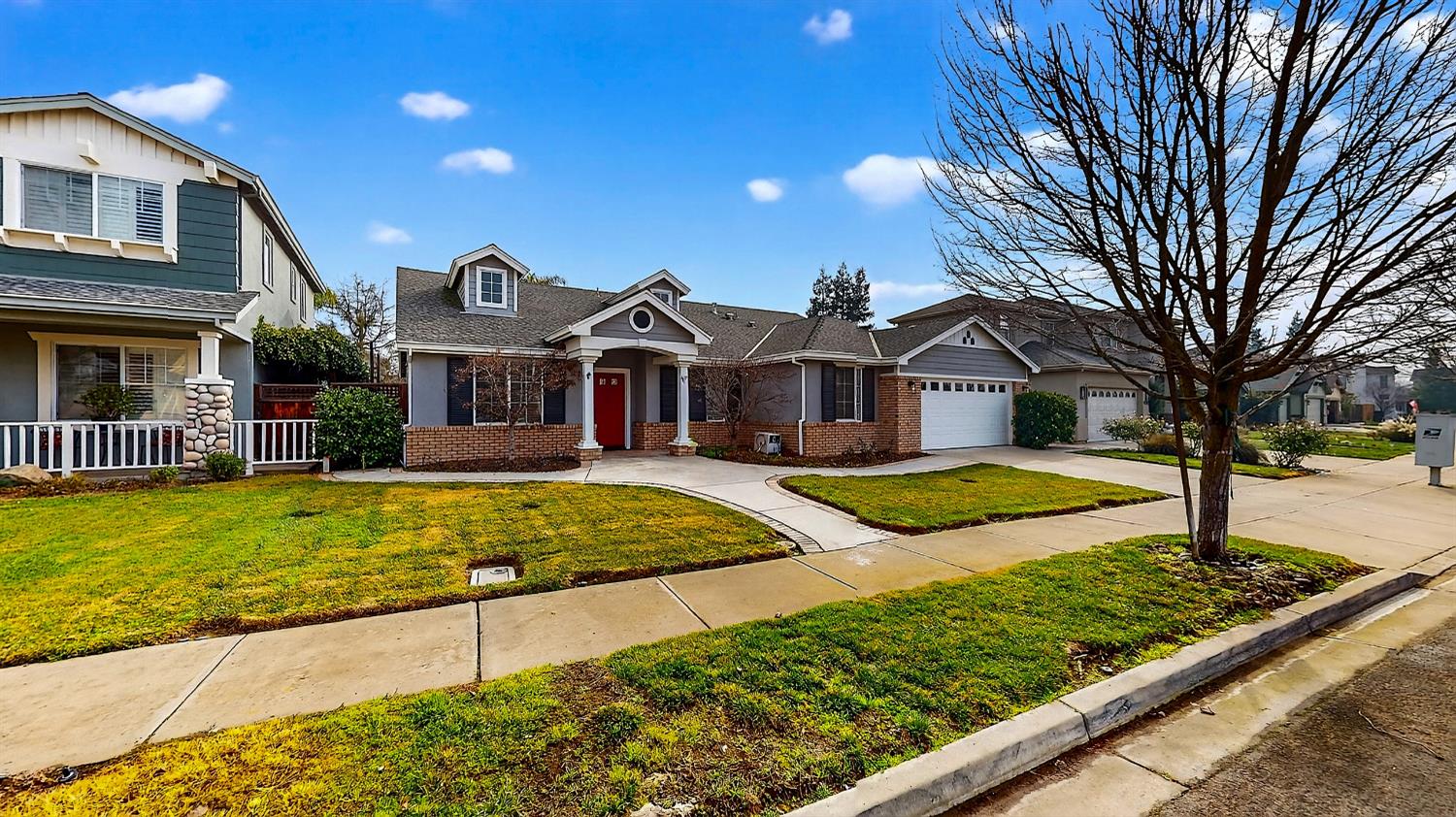 4102 Windrose Drive Turlock, CA 95382 - Photo 5 of 45 a front view of a house with garden