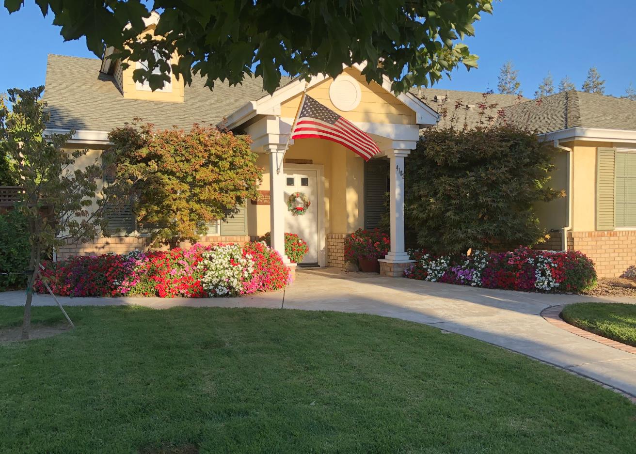 4102 Windrose Drive Turlock, CA 95382 - Photo 6 of 45 a view of a house with a yard and garden