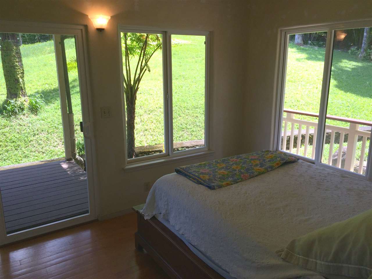 10 Honokaupu Place Haiku, HI 96708 - Photo 12 of 23 a bed sitting in a bedroom next to a window