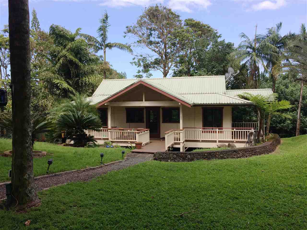 10 Honokaupu Place Haiku, HI 96708 - Photo 2 of 23 a front view of house with a garden and trees