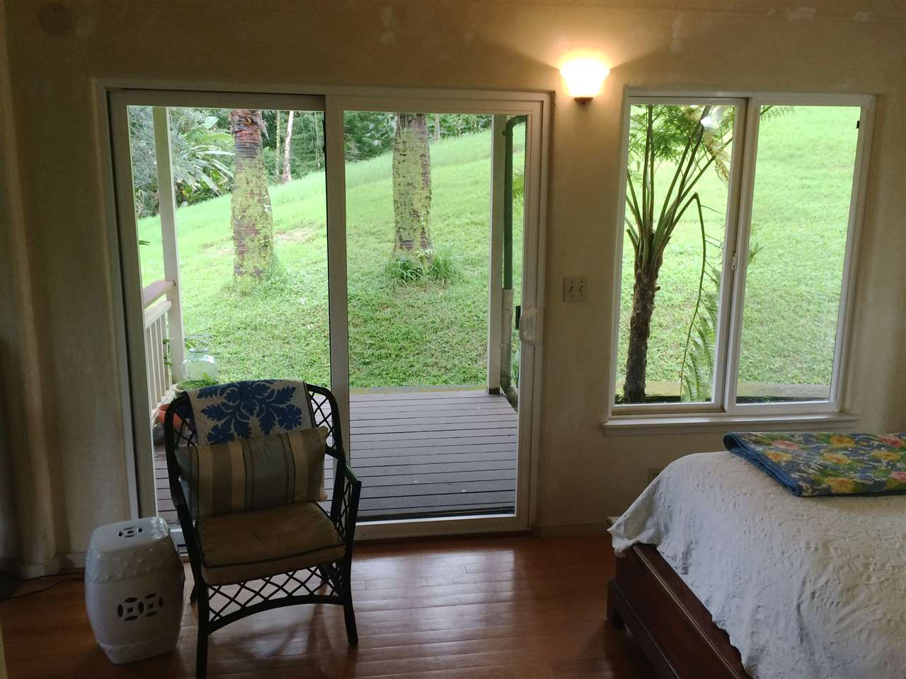 10 Honokaupu Place Haiku, HI 96708 - Photo 6 of 23 a bedroom with a bed and wooden floor