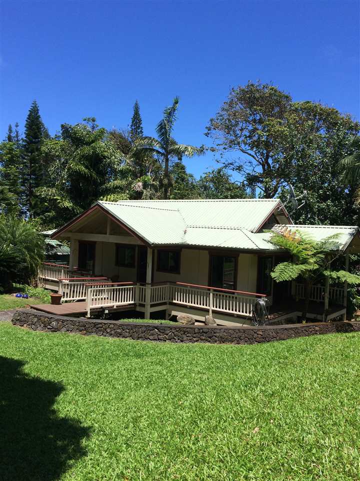 10 Honokaupu Place Haiku, HI 96708 - Photo 10 of 23 a front view of a house with a yard table and chairs