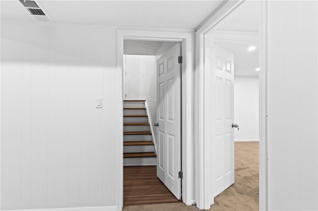 2304 South Hairston Road Decatur, GA 30035 - Photo 12 of 24 a view of a hallway with a wooden floor