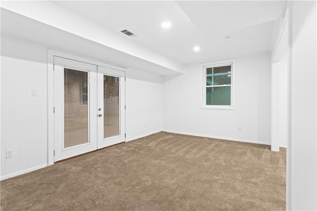 2304 South Hairston Road Decatur, GA 30035 - Photo 17 of 24 an empty room with windows and closet