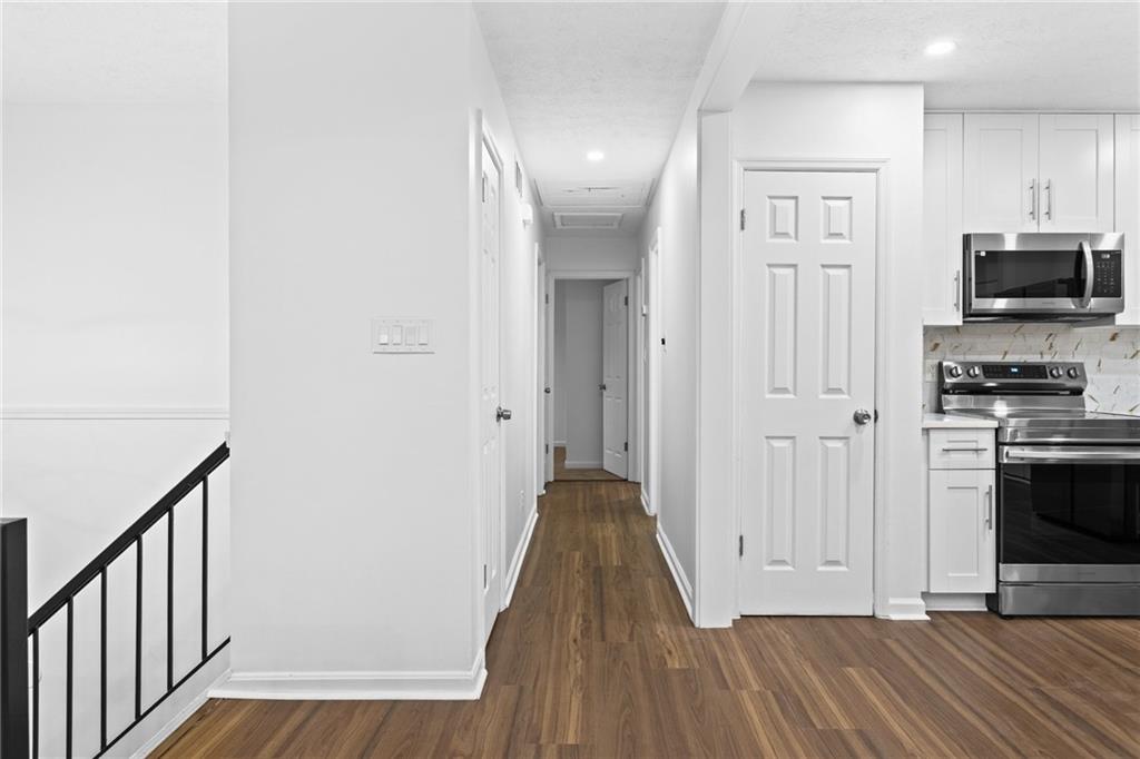 2304 South Hairston Road Decatur, GA 30035 - Photo 9 of 24 a view of a kitchen from the hallway