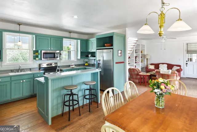 a bedroom with a bed and a chair