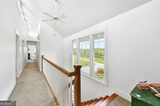 a view of a balcony with lake view and wooden floor