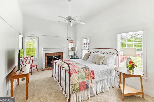 a view of a livingroom with furniture window and wooden floor