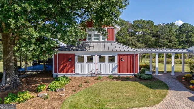 an aerial view of a house with a yard