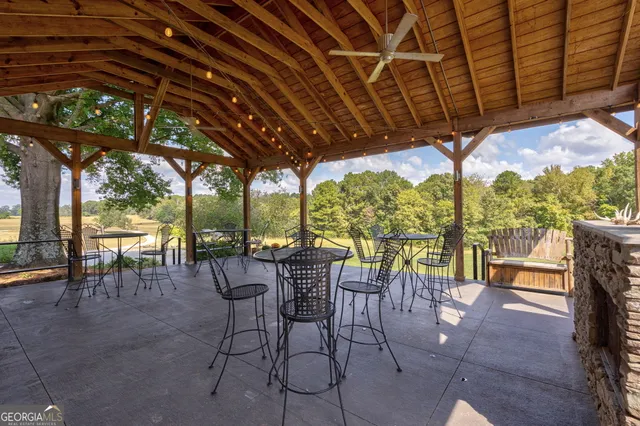 a view of a chairs and table in a patio