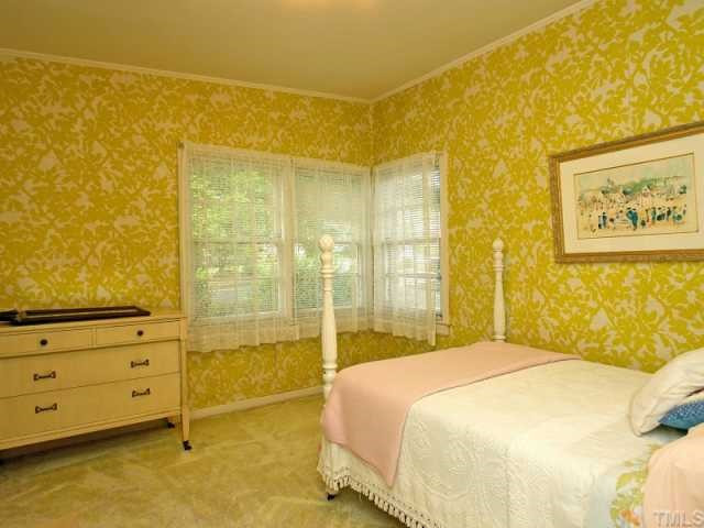 706 Woodburn Road Raleigh, NC 27605 - Photo 9 of 12 Since this photo was taken, the carpet has been removed to set the previously hidden hardwoods free! Bedroom