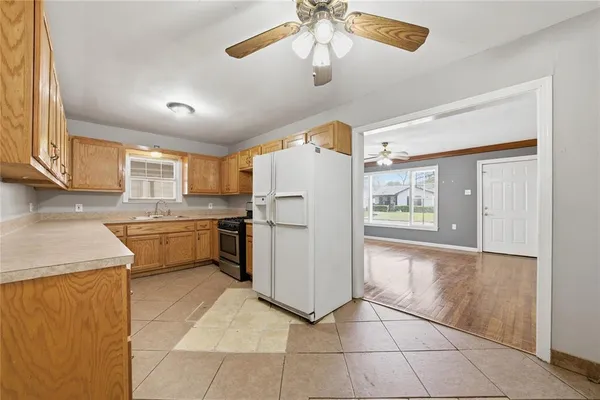 a kitchen with a refrigerator a sink and dishwasher