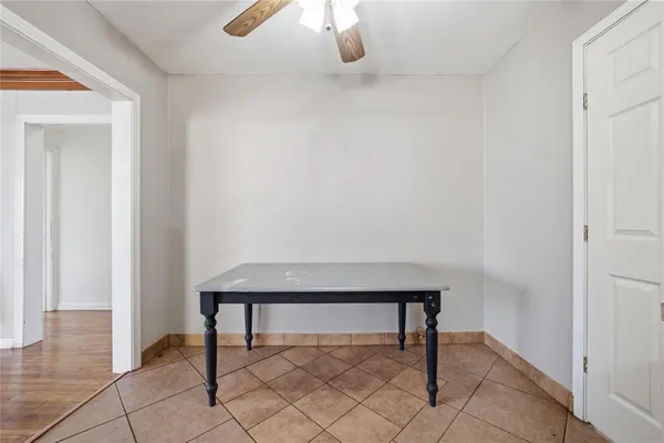 a view of entryway with table and chair