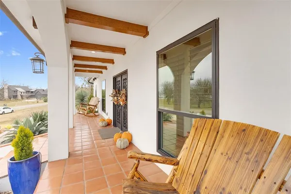 a view of a living room and a balcony