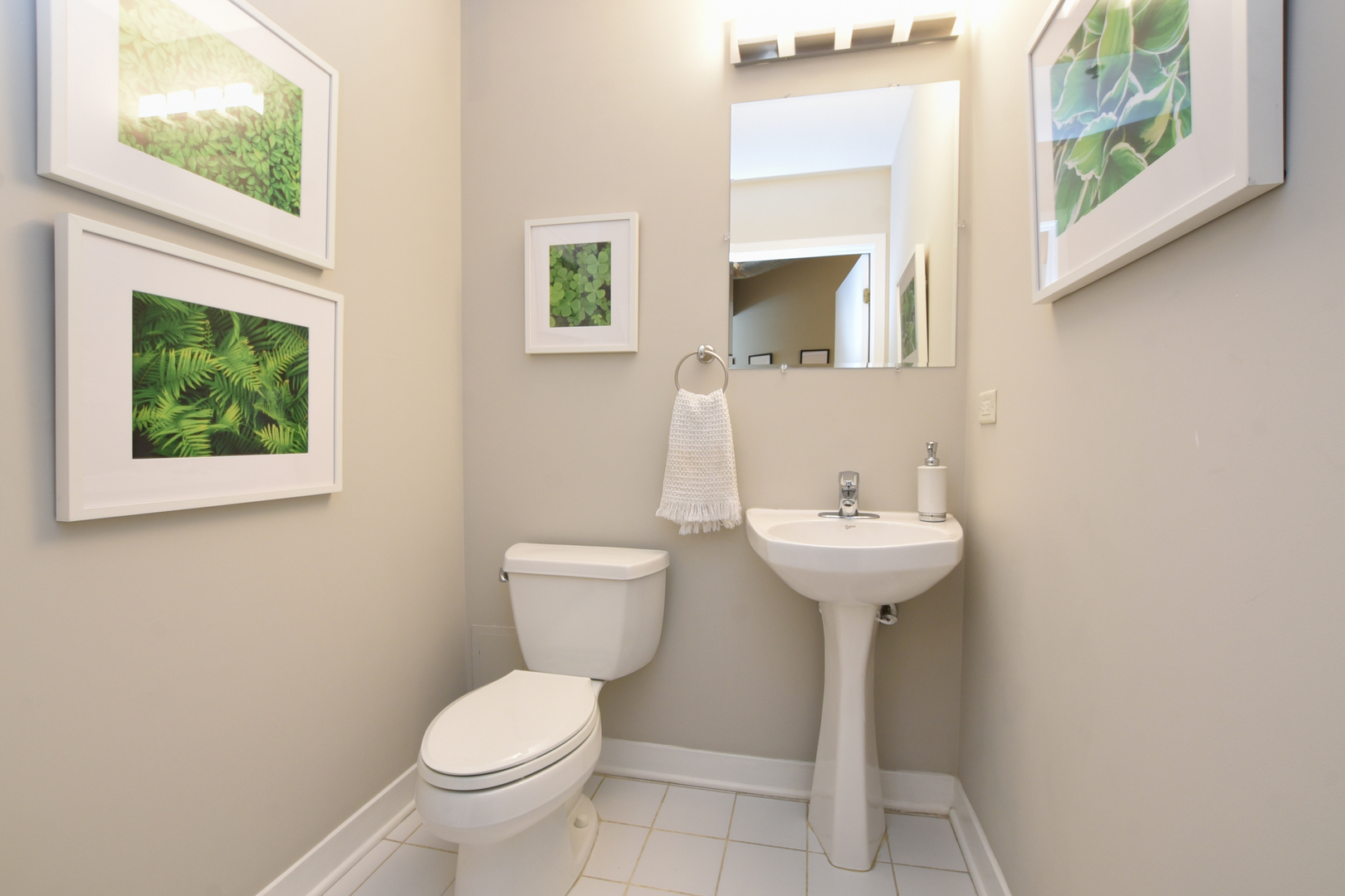 920 West Madison Street, Unit D4 Chicago, IL 60607 - Photo 22 of 34 a bathroom with a toilet sink and mirror
