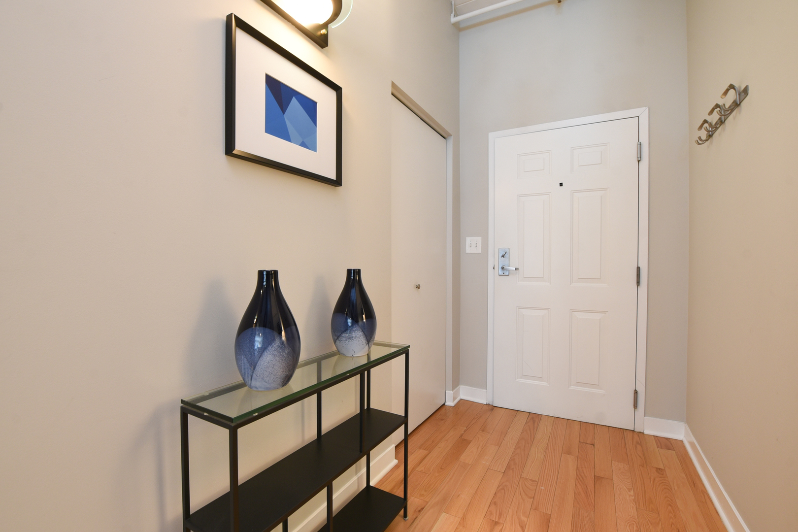 920 West Madison Street, Unit D4 Chicago, IL 60607 - Photo 25 of 34 a view of a hallway with wooden floor and staircase