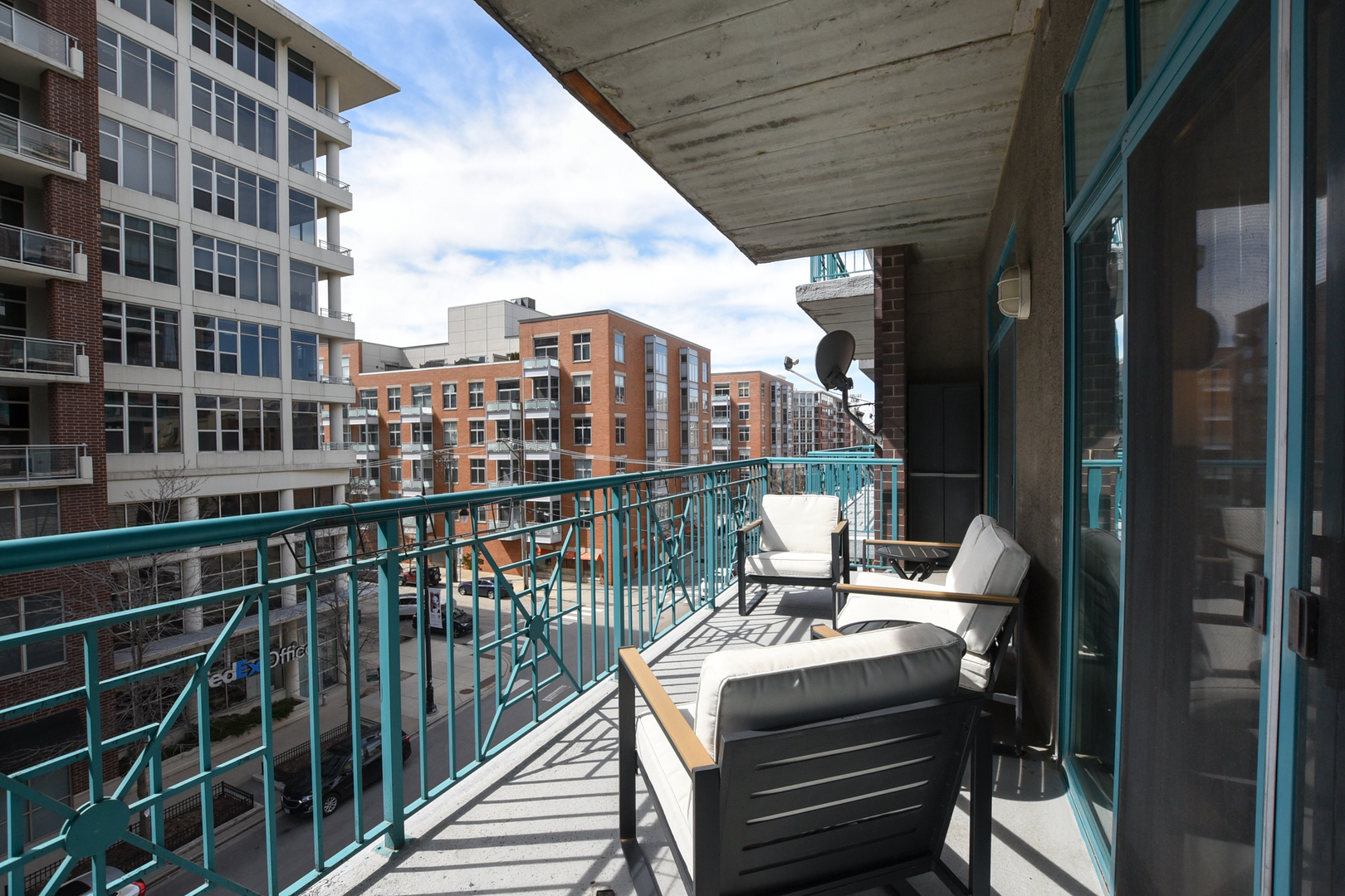 920 West Madison Street, Unit D4 Chicago, IL 60607 - Photo 27 of 34 a view of a balcony with two chairs and a table