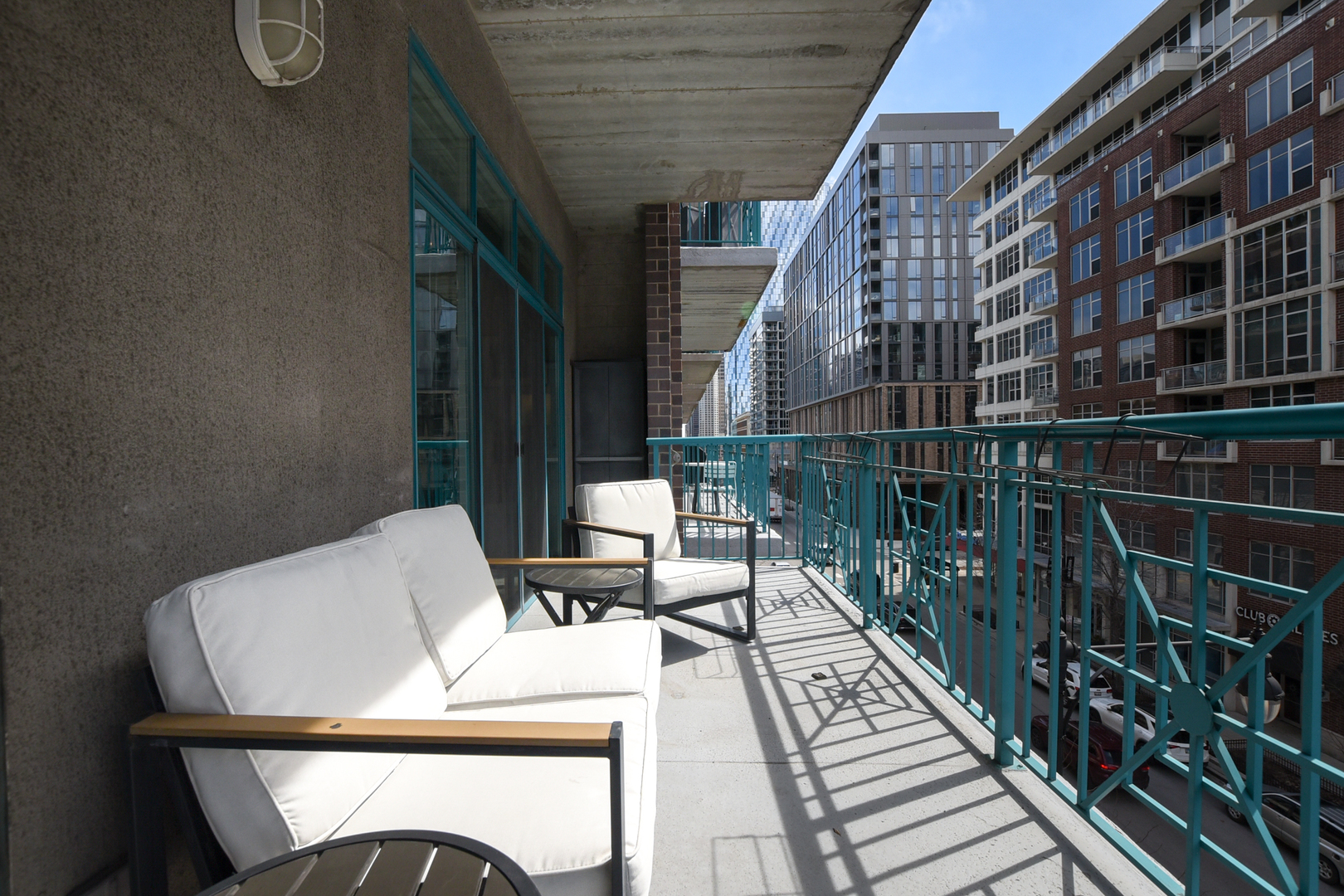 920 West Madison Street, Unit D4 Chicago, IL 60607 - Photo 28 of 34 a view of balcony with wooden floor and outdoor seating