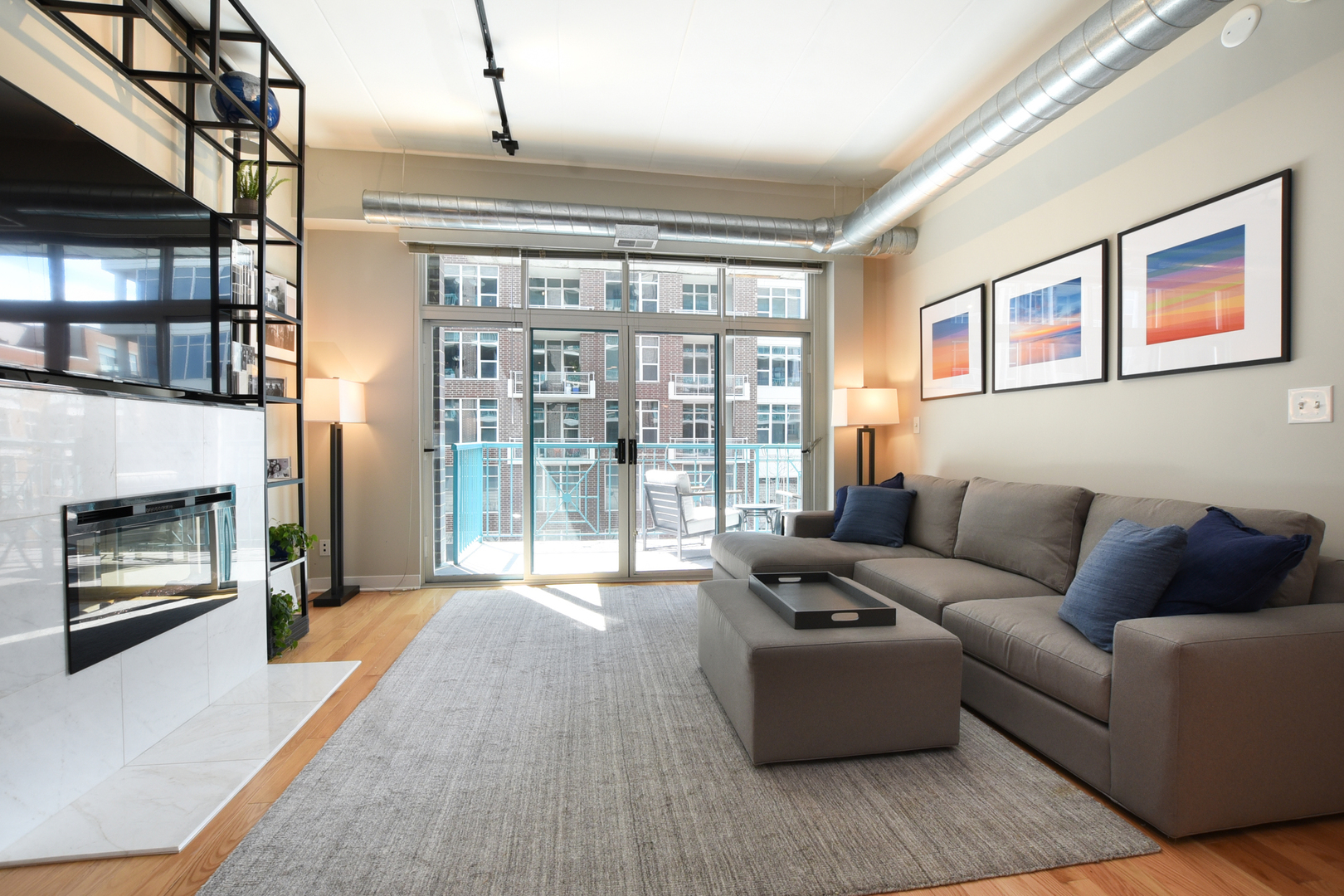 920 West Madison Street, Unit D4 Chicago, IL 60607 - Photo 3 of 34 a living room with furniture and a fireplace