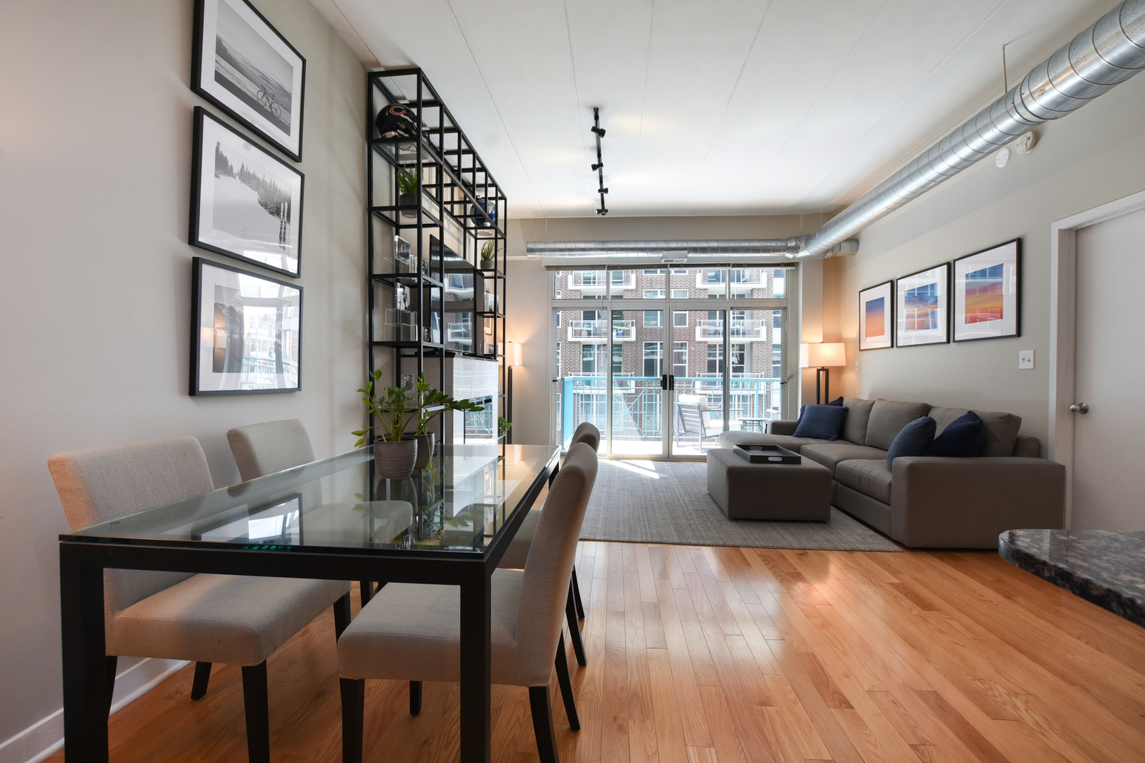 920 West Madison Street, Unit D4 Chicago, IL 60607 - Photo 9 of 34 a living room with furniture and wooden floor