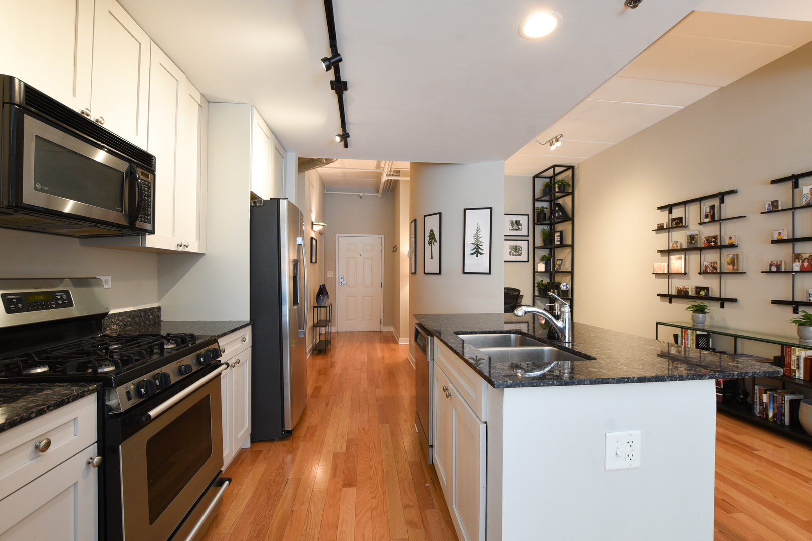 920 West Madison Street, Unit D4 Chicago, IL 60607 - Photo 10 of 34 a kitchen with stainless steel appliances granite countertop a sink stove and refrigerator