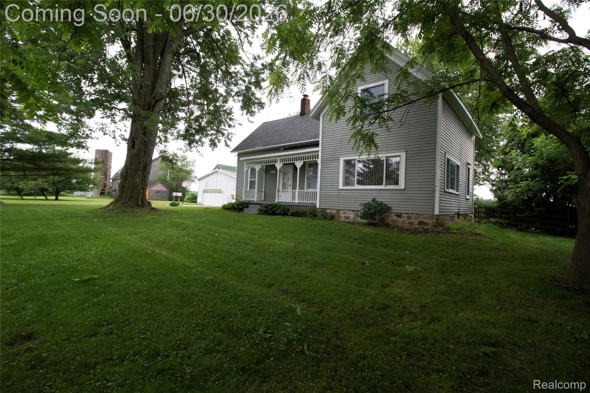 8150 Norman Road Imlay City, MI 48444 - Photo 2 of 58 Expansive green lawn with mature trees