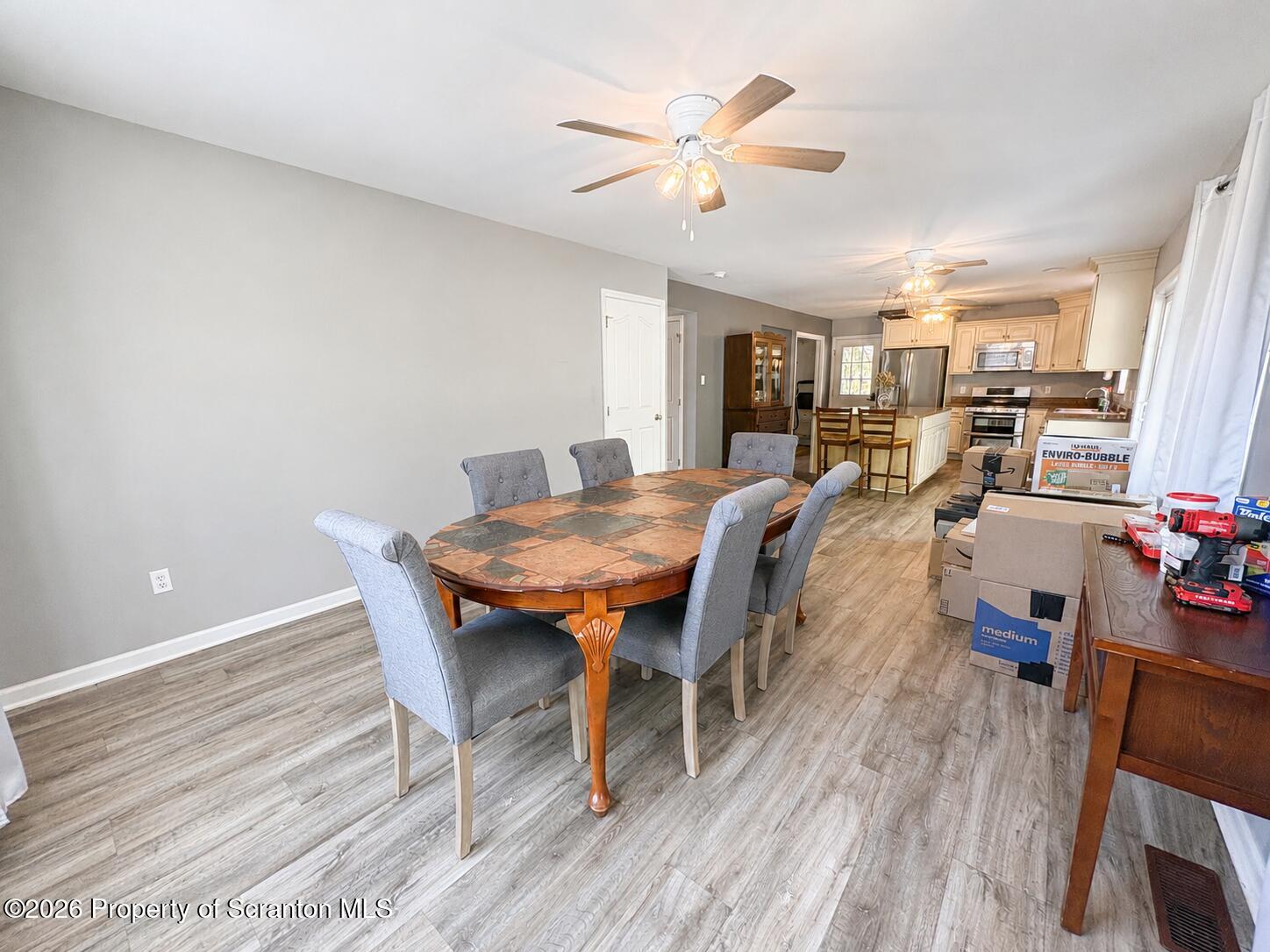 155 Baylor Road Nicholson, PA 18446 - Photo 28 of 53 a view of a dining room with furniture and wooden floor