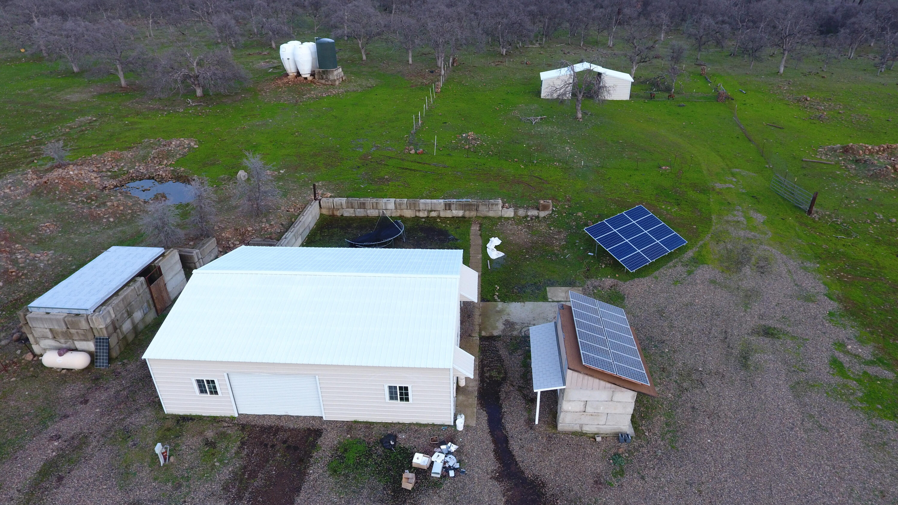7255 Hyrax Road Shingletown, CA 96088 - Photo 69 of 77 Shop barn water tank generator pump hous