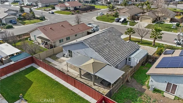 an aerial view of a house with a garden