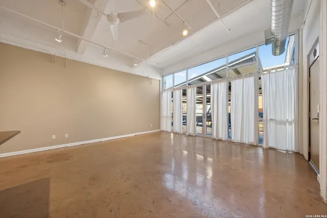 a view of an empty room with windows