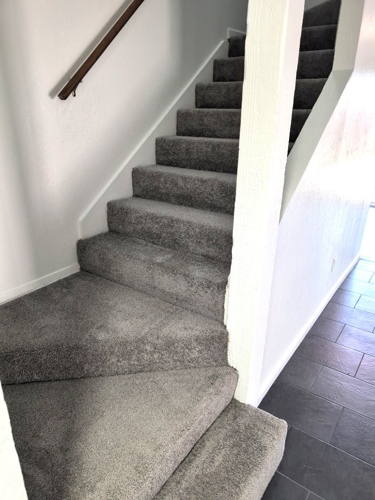 3413 Lynridge Drive, Unit B Austin, TX 78723 - Photo 13 of 23 Staircase with wood finished floors and baseboards