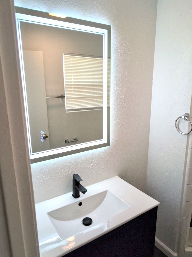 3413 Lynridge Drive, Unit B Austin, TX 78723 - Photo 20 of 23 Bathroom featuring vanity and a textured wall