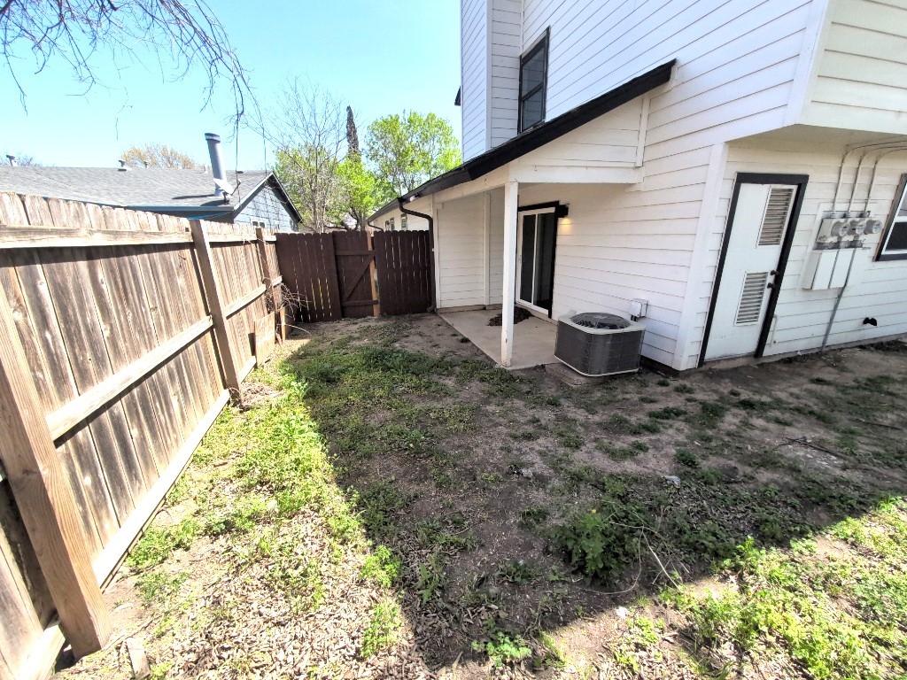 3413 Lynridge Drive, Unit B Austin, TX 78723 - Photo 23 of 23 a view of a backyard with wooden fence