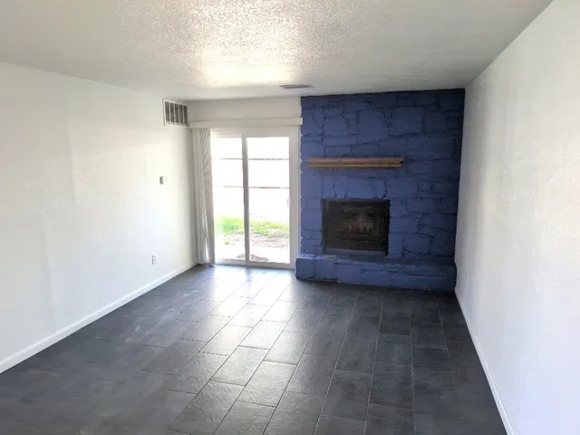 a fireplace with a wooden floor