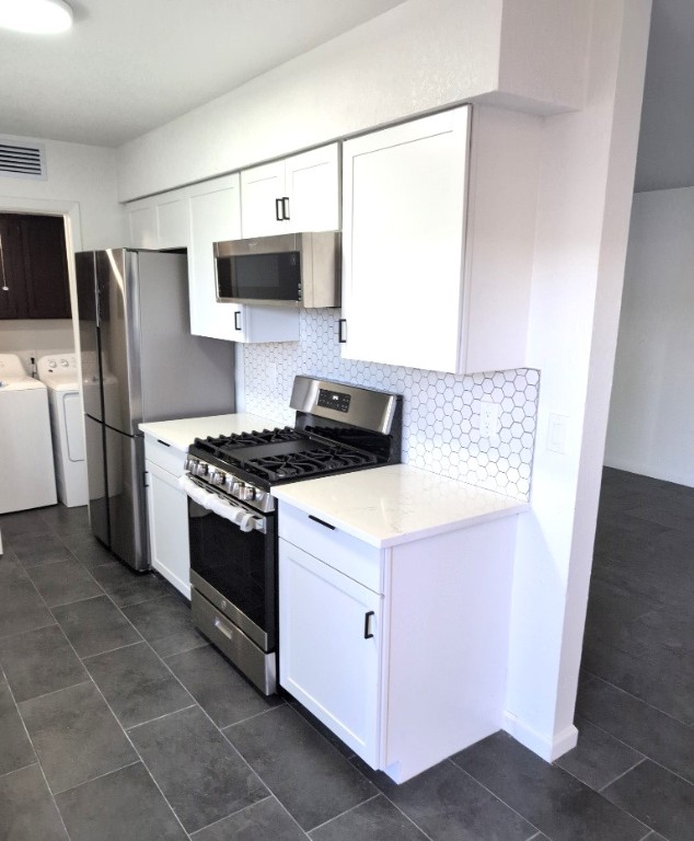 3413 Lynridge Drive, Unit B Austin, TX 78723 - Photo 10 of 23 a kitchen with a stove microwave and refrigerator