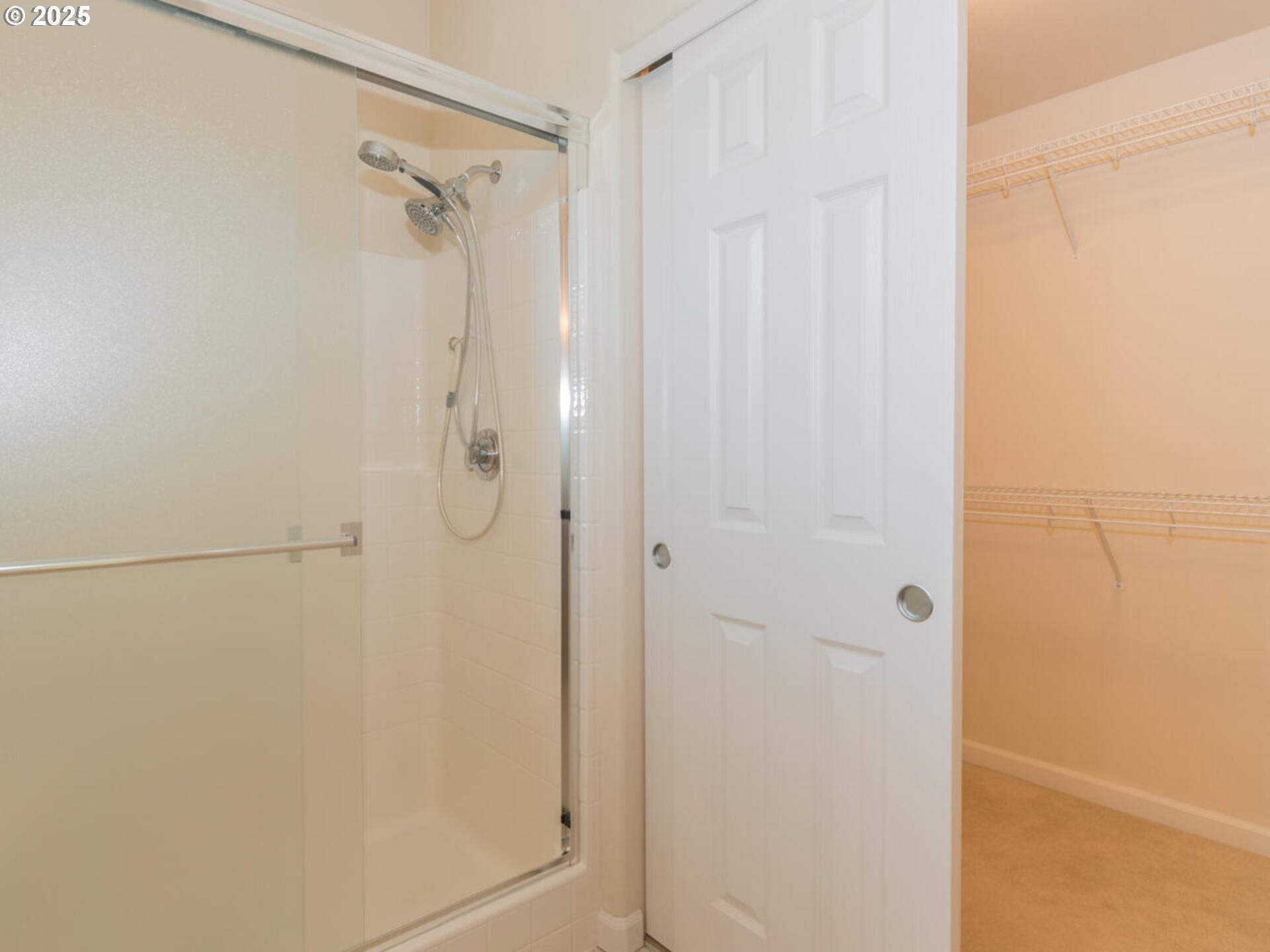 4556 Southwest 11th Street Gresham, OR 97080 - Photo 17 of 31 a bathroom with a glass shower door