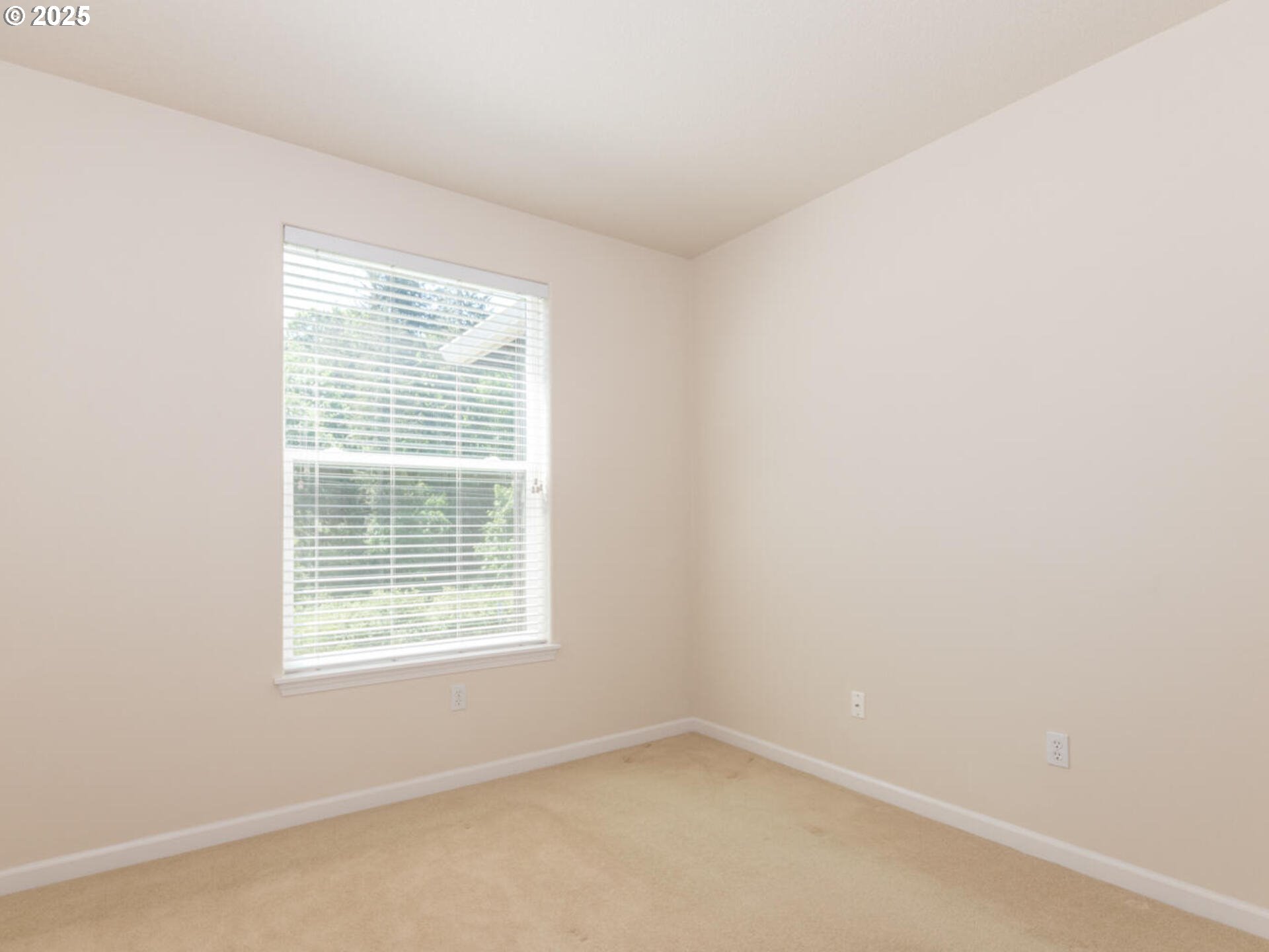 4556 Southwest 11th Street Gresham, OR 97080 - Photo 20 of 31 an empty room with a window