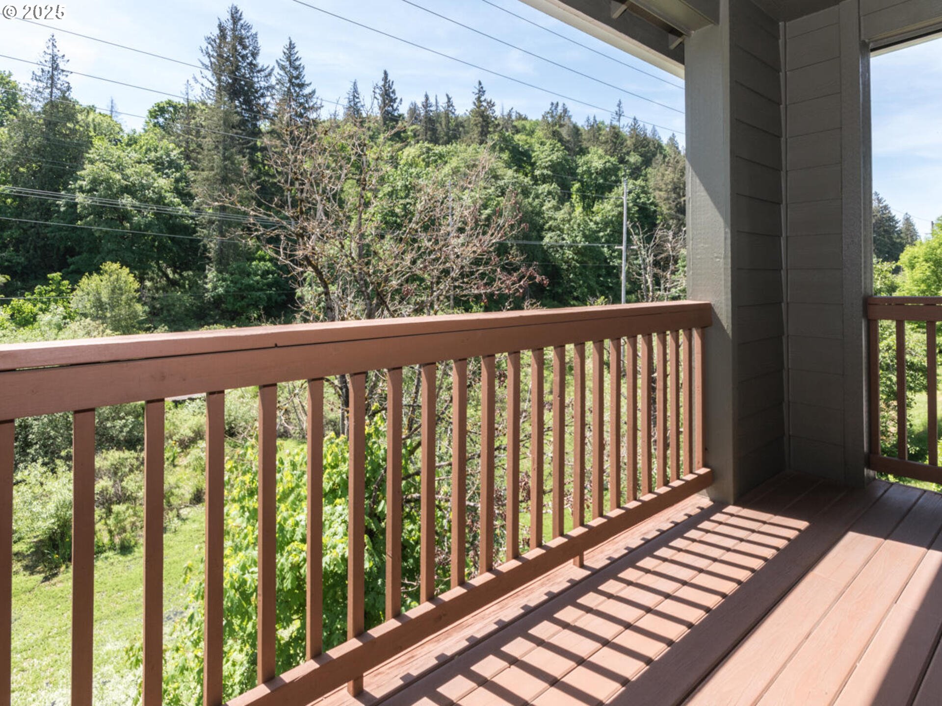 4556 Southwest 11th Street Gresham, OR 97080 - Photo 27 of 31 a view of a balcony with wooden floor